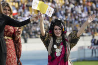 People wait for Pope Francis to celebrate mass at the Franso Hariri Stadium in Irbil, Kurdistan Region of Iraq, Sunday, March 7, 2021. The Vatican and the pope have frequently insisted on the need to preserve Iraq's ancient Christian communities and create the security, economic and social conditions for those who have left to return.(AP Photo/Andrew Medichini)