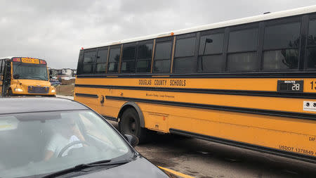 School buses wait outside near the STEM School during a shooting incident in Highlands Ranch, Colorado, U.S. in this May 7, 2019 image obtained via social media. SHREYA NALLAPATI/VIA REUTERS