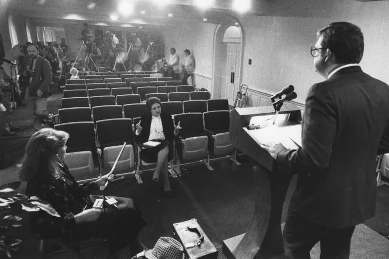 UPI White House reporter Helen Thomas (C) represented all the regular White House reporters during a boycott of a White House news briefing on October 18, 1982. The briefing by Morton Collins, of the National Venture Capital Association, came after Collins presented President Ronald Reagan with a golden egg award, but the reporters were not permitted to view the presentation. Thomas died July 20, 2013. File Photo by Don Rypka/UPI