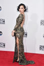 <p>The <i>Confident</i> singer brings Old Hollywood glam to the AMAs red carpet in a sparkly backless gown with finger waves and dark lips.</p>