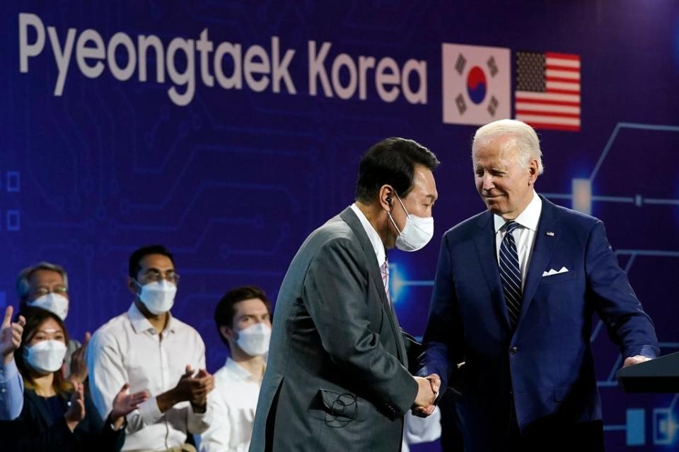 US president Joe Biden and his South Korean counterpart Yoon Suk-yeol deliver remarks at the Samsung Electronics Pyeongtaek campus on 20 May in Pyeongtaek, South Korea (AP)