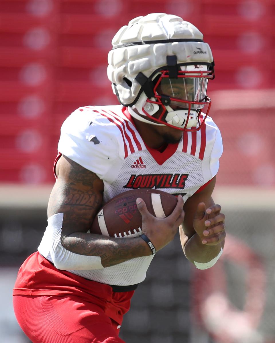 Jalen Mitchell gains yardage during practice at Cardinal Stadium on Sunday, April 3, 2021