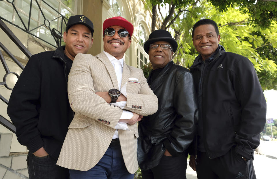 In this Tuesday, Feb. 26, 2019, Marlon Jackson, second from left, Tito Jackson, second from right, and Jackie Jackson, far right, brothers of the late musical artist Michael Jackson, and Tito's son Taj, far left, pose together for a portrait outside the Four Seasons Hotel, in Los Angeles. Jackie, Tito, Marlon and Taj Jackson, gave the first family interviews Tuesday on “Leaving Neverland,” which features two Michael Jackson accusers and is set to air on HBO starting Sunday, March 3. (Photo by Chris Pizzello/Invision/AP)