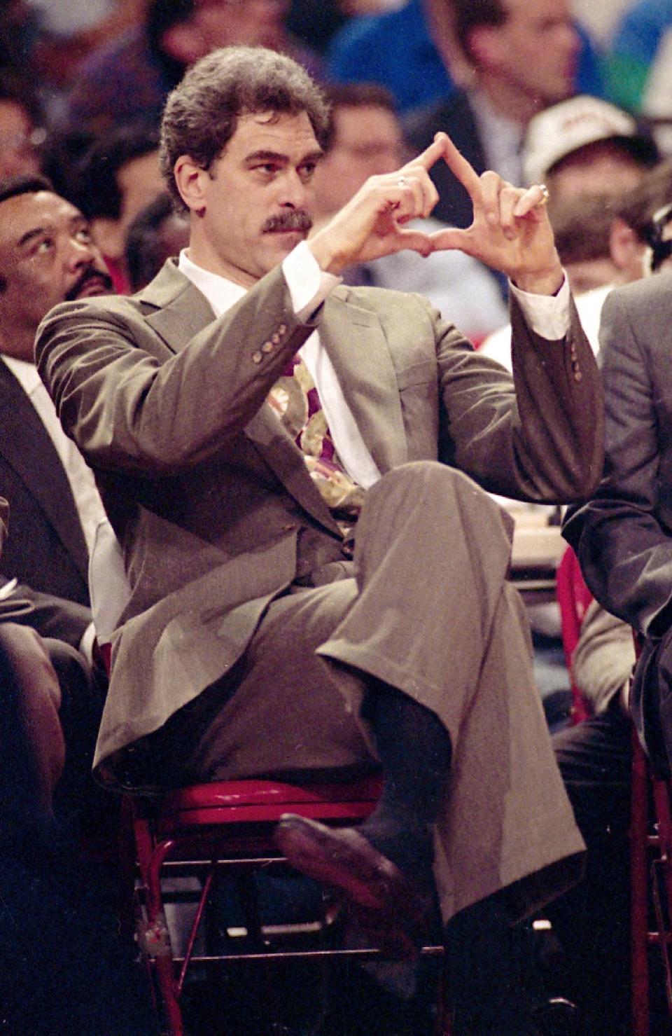 FILE - In this June 6, 1991, file photo, Chicago Bulls head coach Phil Jackson directs the offense during third quarter action against the Los Angeles Lakers in Game 2 of the NBA Finals in Chicago. Jackson will be introduced as the newest member of the New York Knicks' front office Tuesday morning, according to a person familiar with the negotiations between the 11-time champion coach and the team. The person spoke on condition of anonymity on Friday, March 14, 2014, because the Knicks would only confirm that a "major announcement" involving team executives was scheduled. (AP Photo/John Swart/File)