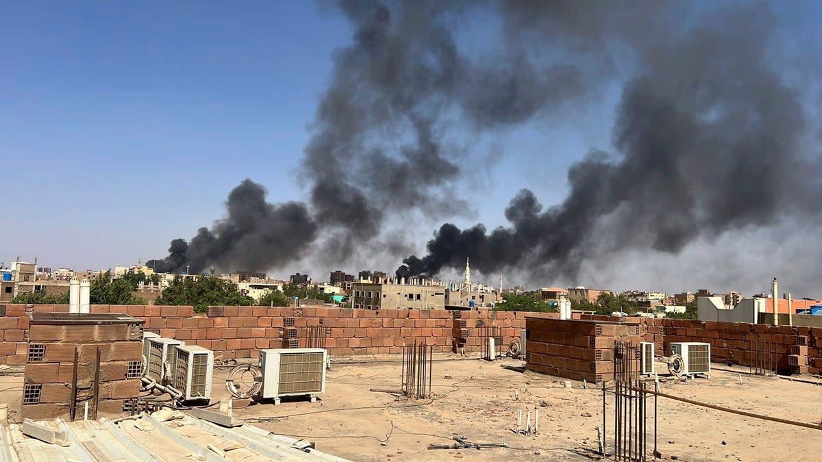 Smoke fills the sky in Khartoum amid increasing violence and dwindling supplies (AP)