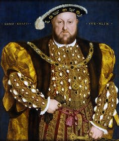 A portrait of Henry VIII in gold finery.