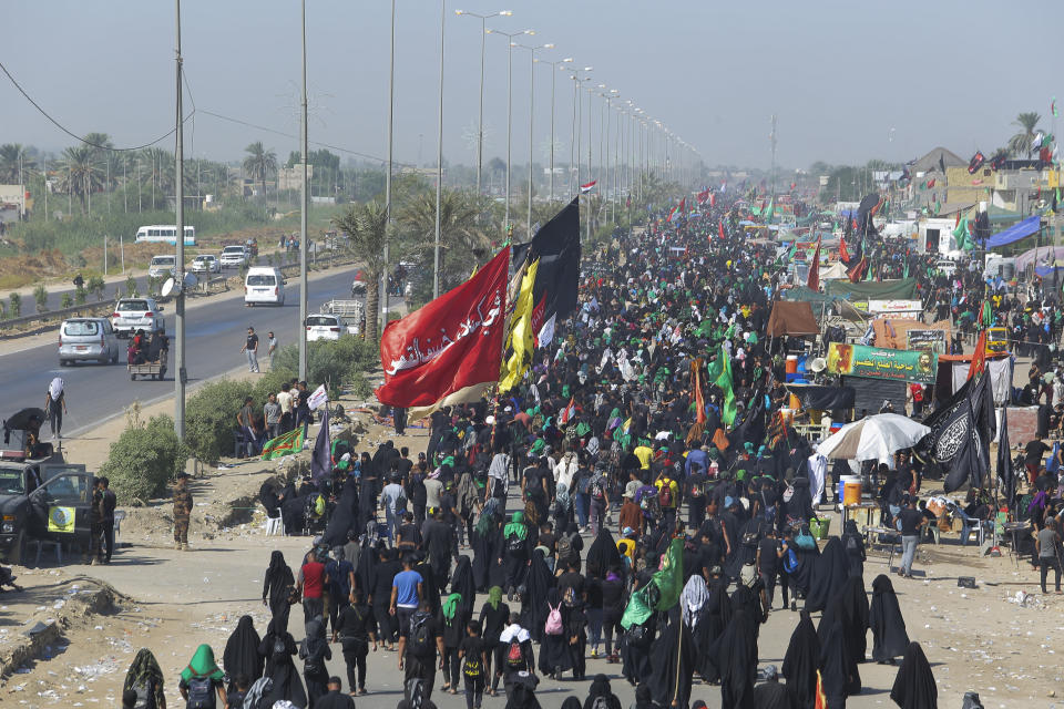 Shiite pilgrims arrive Karbala, Iraq, for the Arbaeen ritual Tuesday, Oct. 6, 2020. Arbaeen holiday marks the end of the forty day mourning period after the anniversary of the martyrdom of Imam Hussein, the Prophet Muhammad's grandson in the 7th century. (AP Photo/Anmar Khalil)(AP Photo/Anmar Khalil)