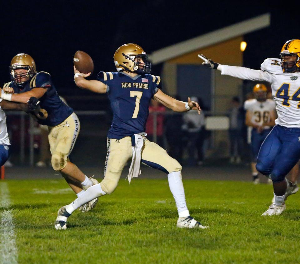 New Prairie senior quarterback Marshall Kmiecik (7) throws a pass in the first half of a football game against South Bend Riley Friday, Sept. 29, 2023, at New Prairie High School in New Carlisle.