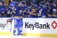 Buffalo Sabres forward Zemgus Girgensons (28) is congratulated for his goal during the second period of the team's NHL hockey game against the Vancouver Canucks, Tuesday, Oct. 19, 2021, in Buffalo, N.Y. (AP Photo/Jeffrey T. Barnes)