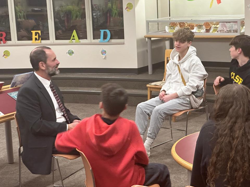 Joseph Case Junior High School Principal Robert Silveira speaks with students during a community forum to meet the superintendent candidates on Monday, Feb. 12.