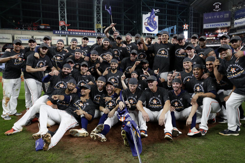Houston Astros pose after winning Game 6 of baseball's American League Championship Series against the New York Yankees Saturday, Oct. 19, 2019, in Houston. The Astros won 6-4 to win the series 4-2. (AP Photo/Eric Gay)