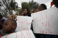 <p>People join together to mark the 8th anniversary of the massive earthquake in Haiti and to condemn President Donald Trump’s reported statement about immigrants from Haiti, Africa and El Salvador on Jan. 12, 2018 in Miami, Fla. (Photo: Joe Raedle/Getty Images) </p>