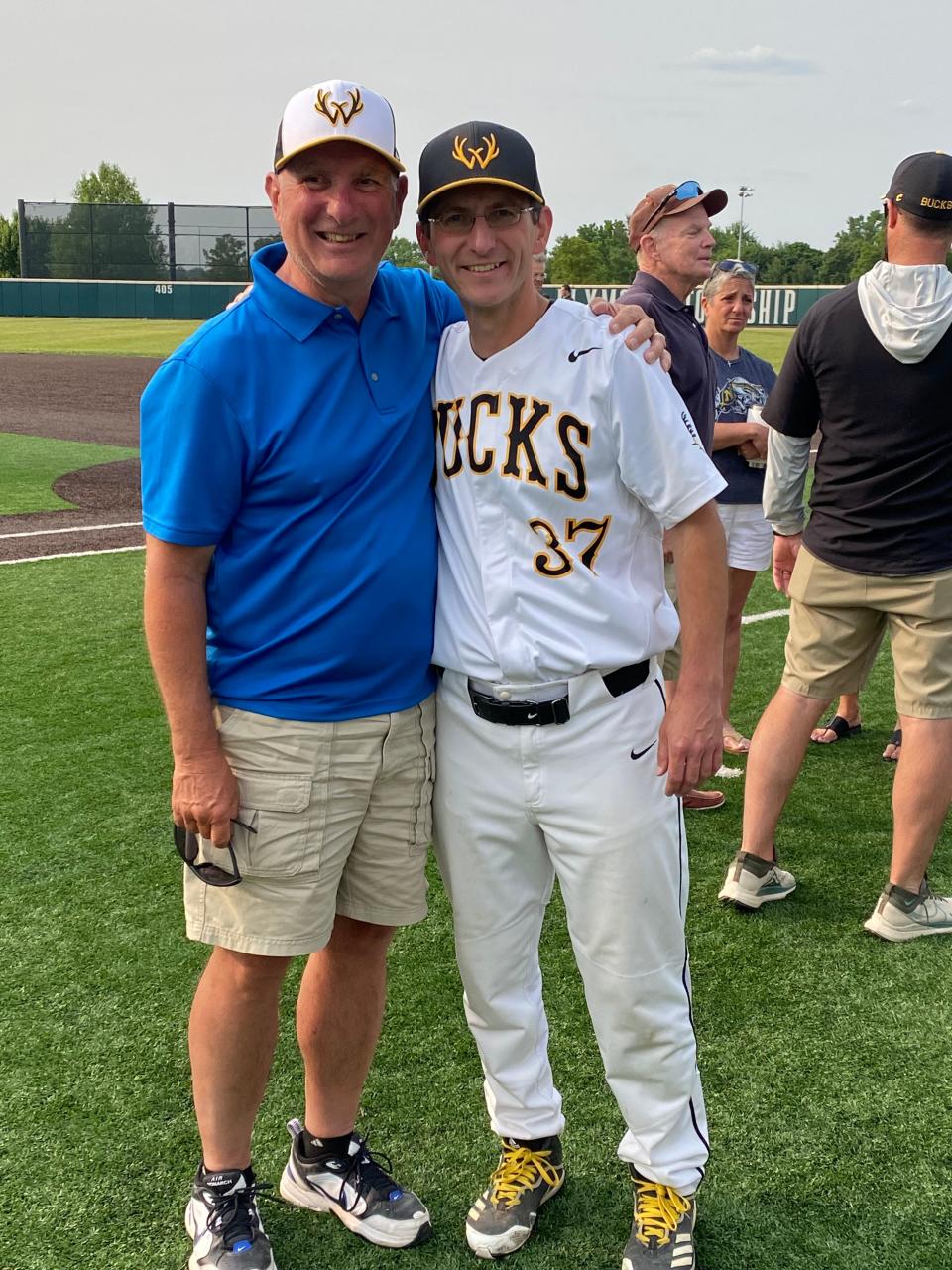 Dad Dwight Weaver (left) and son Brian, the Central Bucks West baseball coach, share a moment after Monday's 3-0 PIAA state playoff win over Wilson West Lawn.