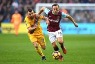 <p>Mark Noble launches an attack for West Ham</p>