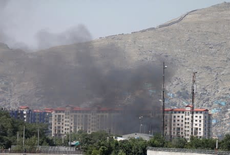 Smoke rises from the site of a blast and gunfire in Kabul, Afghanistan July