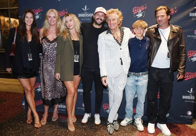 <p>Denise Truscello/Getty</p> Rod Stewart (third from right) and his family