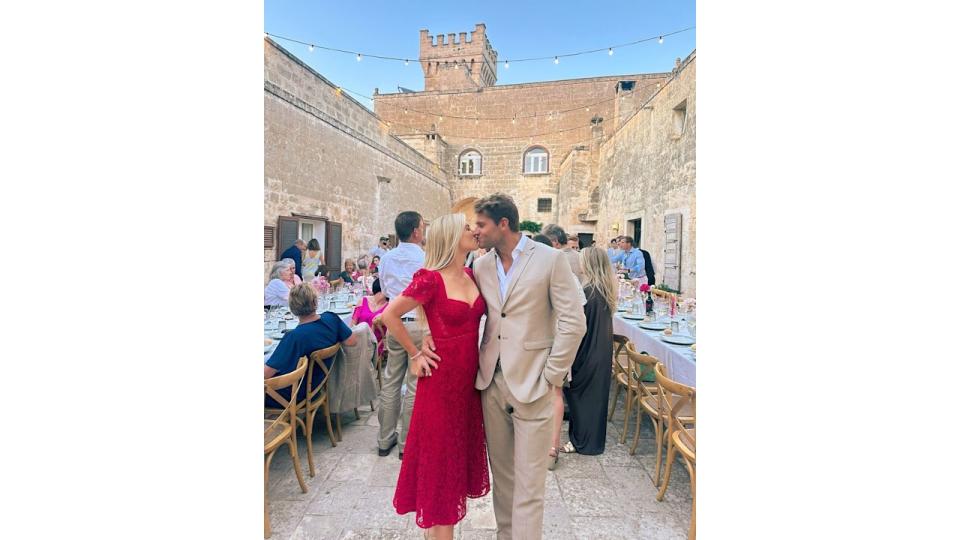 Amelia Spencer kissing husband Greg Mallett at Italian wedding 