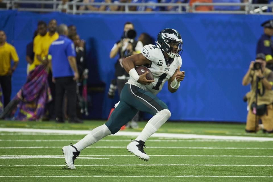 Philadelphia Eagles quarterback Jalen Hurts rushes against the Detroit Lions.