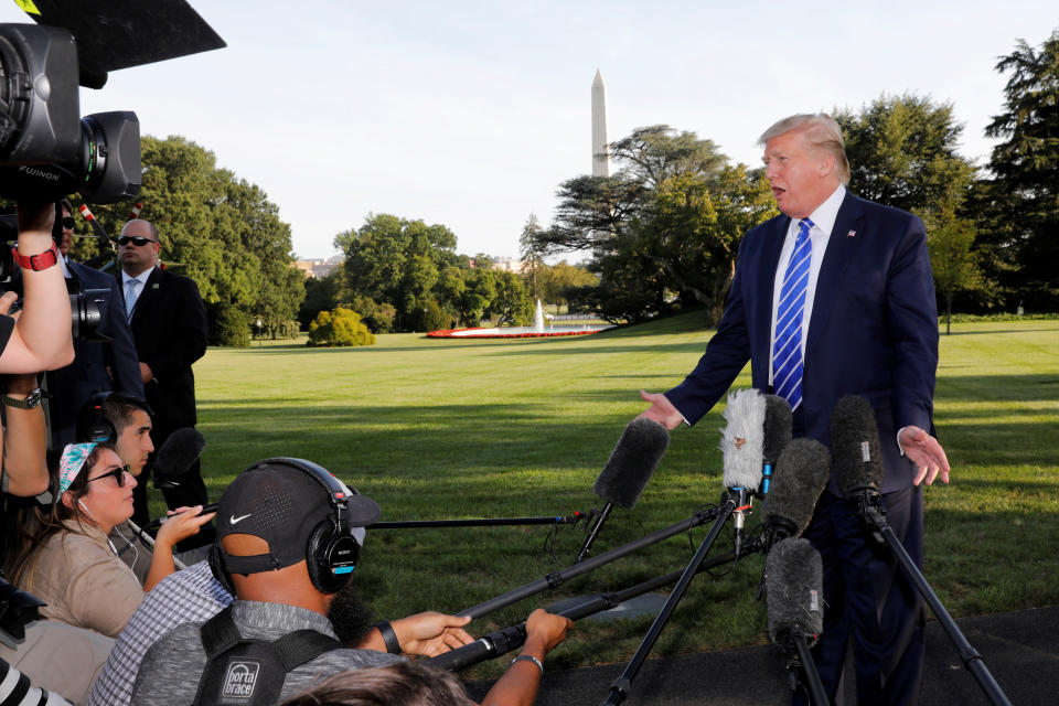 U.S. President Donald Trump speaks with reporters on the South Lawn of the White House in Washington, U.S., before his departure to Camp David, August 30, 2019. REUTERS/Yuri Gripas