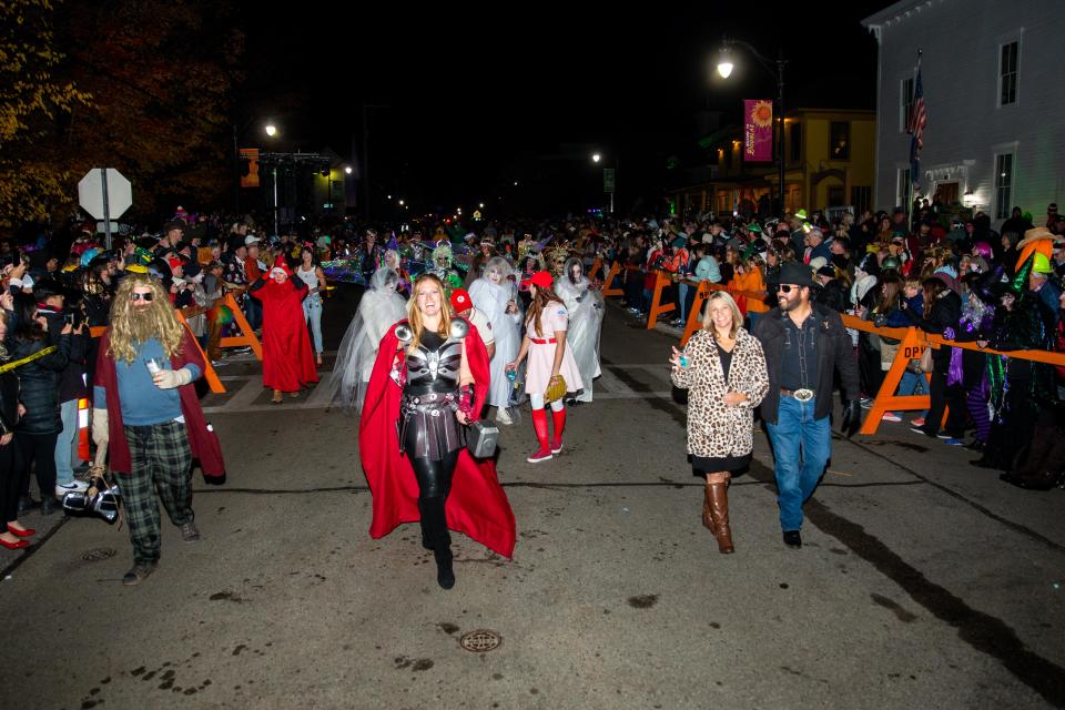 Adults walk the parade route in Douglas on Saturday, Oct. 29, 2022.