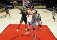 Portland Trail Blazers guard Damian Lillard, left drives to the basket on San Antonio Spurs forward Drew Eubanks, right, during the second half of an NBA basketball game in Portland, Ore., Saturday, May 8, 2021. The Blazers won 124-102. (AP Photo/Steve Dykes)