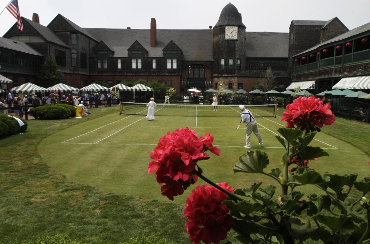 International Tennis Hall of Fame volunteers play an exhibition match in vintage clothing in 2015.