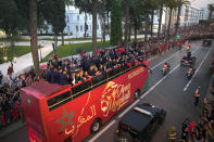 The players of Morocco national soccer team celebrate on a bus and wave during a homecoming parade in central Rabat, Morocco, Tuesday, Dec. 20, 2022. Morocco national team won the fourth place at the last World Cup. (AP Photo/Mosa'ab Elshamy)