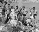 <p>Your cookouts probably don't look like this one. Back in the 1940s, young people donned their retro swimsuits and cooked beachside in Los Angeles. </p>