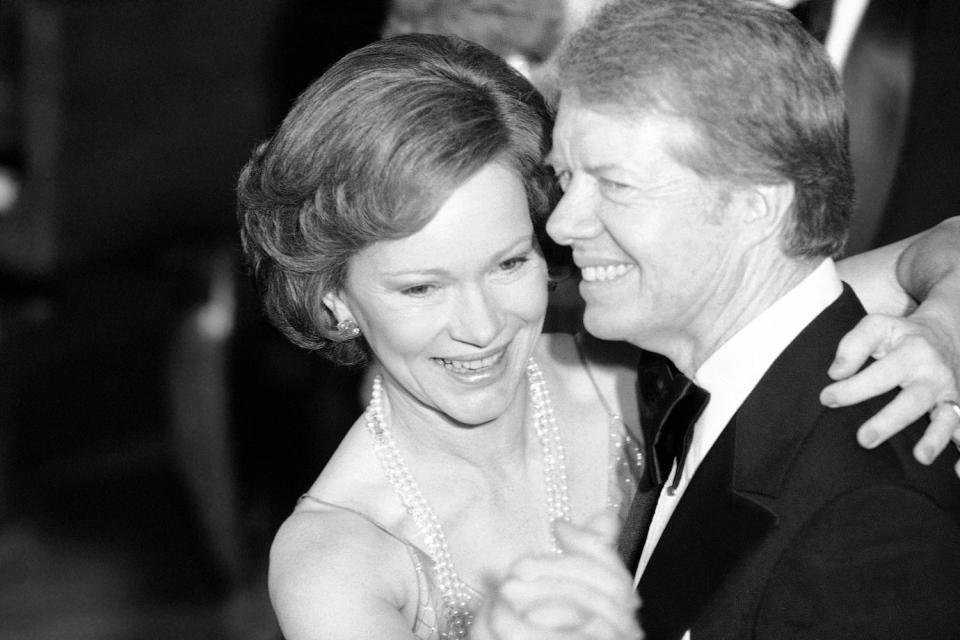 FILE - In this Dec. 13, 1978 file photo, President Jimmy Carter and his wife Rosalynn lead their guests in dancing at the annual Congressional Christmas Ball at the White House in Washington. Jimmy Carter and his wife Rosalynn celebrate their 75th anniversary this week on Thursday, July 7, 2021. (AP Photo/Ira Schwarz, File) (Ira Schwarz / AP file)