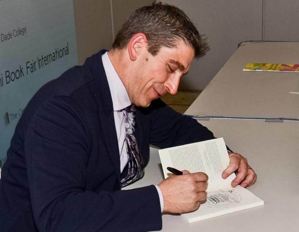 Poet Richard Blanco signing his book at the Miami Book Fair in 2013.