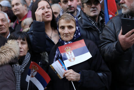 People watch a march during the visit of Russian President Vladimir Putin in Belgrade, Serbia, January 17, 2019. REUTERS/Kevin Coombs