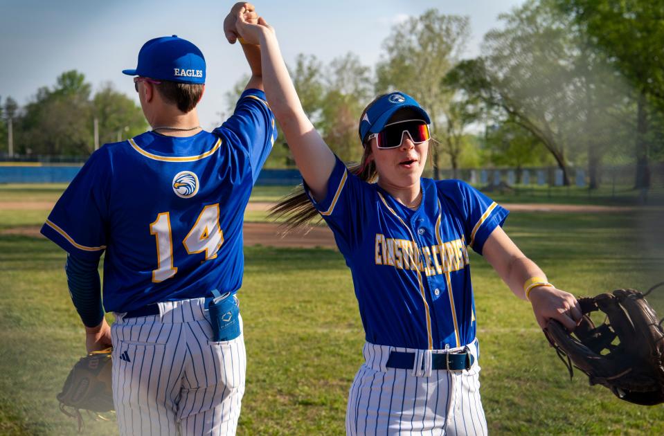 Evansville Christian’s Jayden Gates, right, spins Jacie Arnold, left, before taking the field for their game against the Mt. Vernon Wildcats Wednesday, April 26, 2023. 