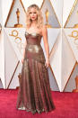 <p><i>Mother!</i> star Jennifer Lawrence selected a design from Dior for her evening at the Oscars that mimicked the Oscar award itself. (Photo: Getty Images) </p>