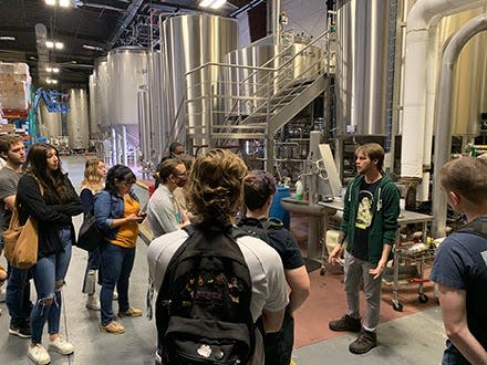 Students is USF Sarasota-Manatee's "Introduction to Beer Science" visit Coppertail Brewing in Tampa. The class includes a virtual exchange with students at the Universidade Estadual Paulista in Brazil.