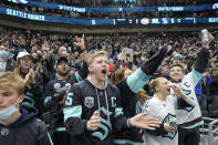 Seattle Kraken fans at Climate Pledge Arena cheer at the end of the third period of an NHL hockey game against the Montreal Canadiens, Tuesday, Oct. 26, 2021, in Seattle. The Kraken won 5-1. (AP Photo/Ted S. Warren)