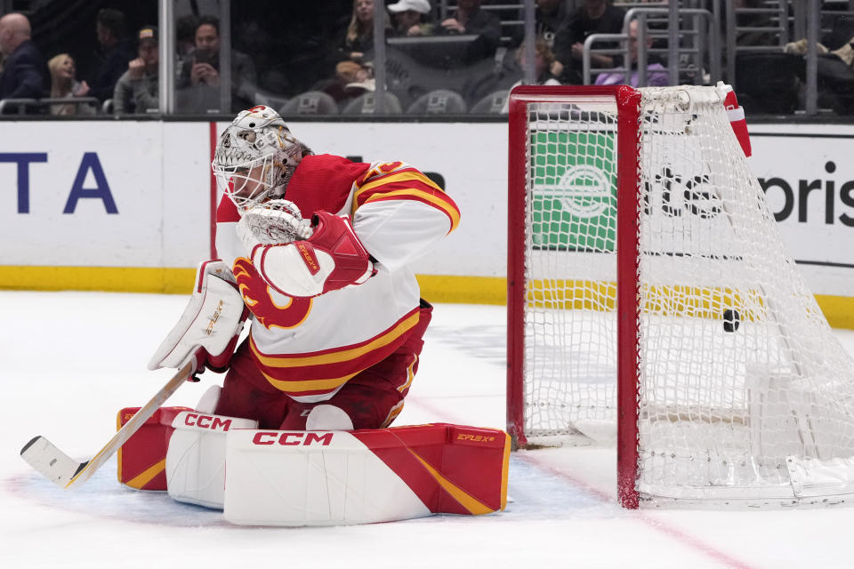 Calgary Flames goaltender Jacob Markstrom gives up a goal on a shot from Los Angeles Kings right wing Adrian Kempe during the second period of an NHL hockey game Monday, March 20, 2023, in Los Angeles. (AP Photo/Marcio Jose Sanchez)