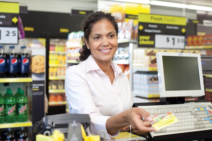 Woman paying at register