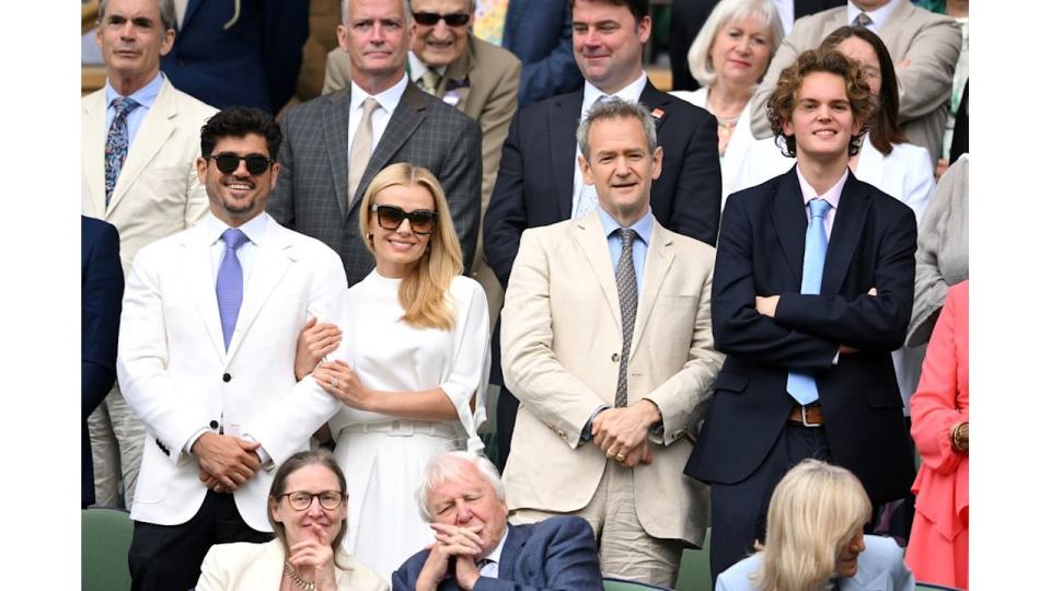 father and son watching tennis