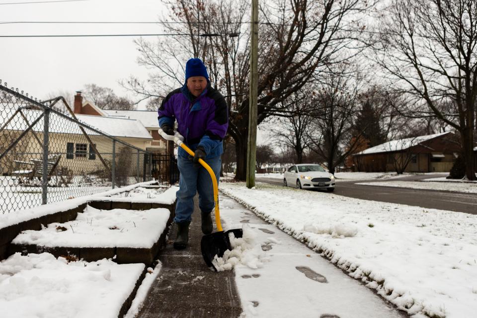 Rockford resident Jerry Antosch shovels his sidewalk and driveway before temperatures drop on Tuesday, Jan. 9, 2024, in Rockford.