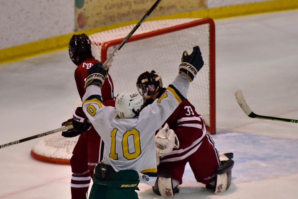 Luke Dickerson, #10 of Morris Knolls/Hills reacts following his goal as Morristown Beard goaltender Casey Connor, #33, fails to save in the third period during their Mennen Cup Final at Mennen Arena in Morristown on Monday, February 14,2022.