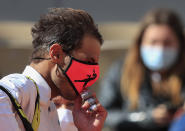 Spain's Rafael Nadal adjusts his face mask after winning his fourth round match of the French Open tennis tournament against Sebastian Korda of the U.S. at the Roland Garros stadium in Paris, France, Sunday, Oct. 4, 2020. (AP Photo/Michel Euler)