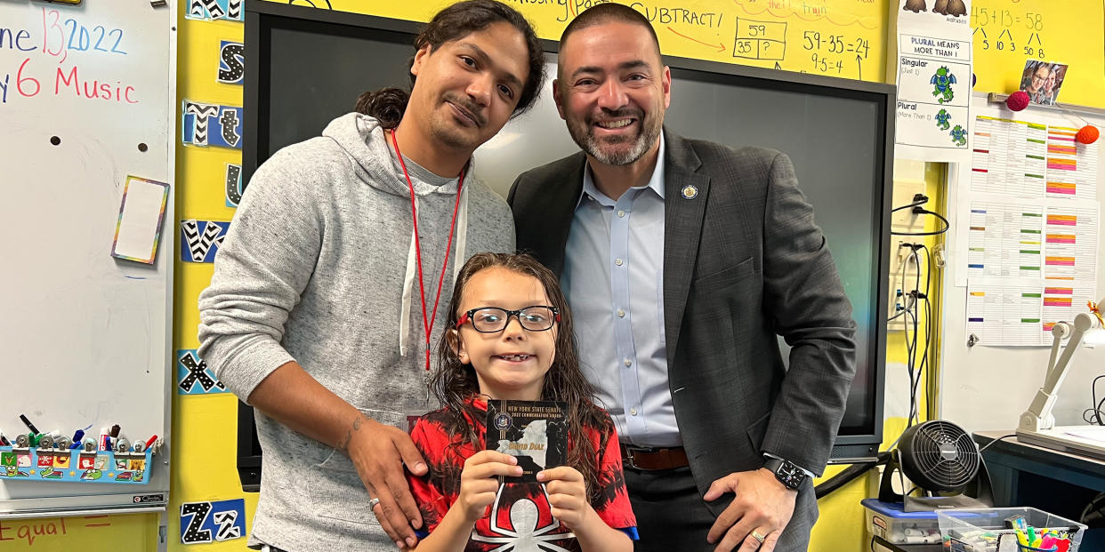 David Diaz Jr., center, received the New York State Senate Commendation Award for saving a choking classmate. He is pictured with his father, David Diaz Sr., left, and New York State Sen. Fred Akshar, right. (Courtesy Office of Senator Fred Akshar)