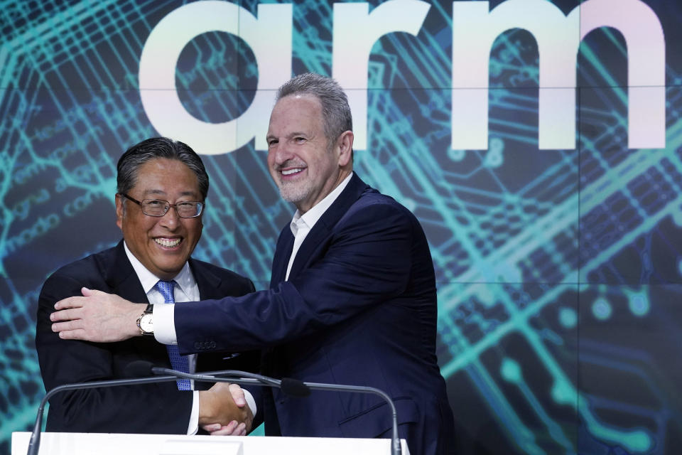 ARM Holdings CEO Rene Haas, right, and Softbank CFO Yoshimitsu Goto shake hands at the Nasdaq MarketSite, during the ARM Holdings IPO, in New York's Times Square, Thursday, Sept. 14, 2023. (AP Photo/Richard Drew)