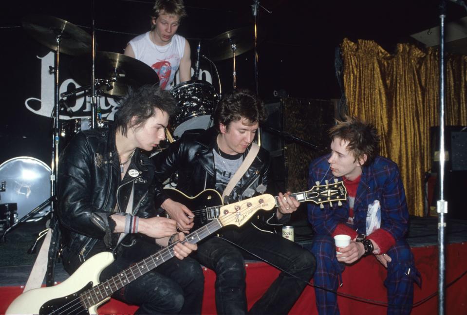 UNITED STATES - JANUARY 10:  TEXAS  Photo of Johnny ROTTEN and Steve JONES and Sid VICIOUS and SEX PISTOLS, Sid Vicious, Paul Cook (at back), Steve Jones & Johnny Rotten (John Lydon) posed, group shot, onstage at the Longhorn Ballroom, Dallas  (Photo by Richard E. Aaron/Redferns)