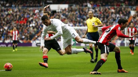 Football Soccer - Real Madrid v Athletic Bilbao - Spanish Liga BBVA - Santiago Bernabeu stadium, Madrid, Spain - 13/02/16 Real Madrid's Cristiano Ronaldo falls to the ground. REUTERS/Andrea Comas