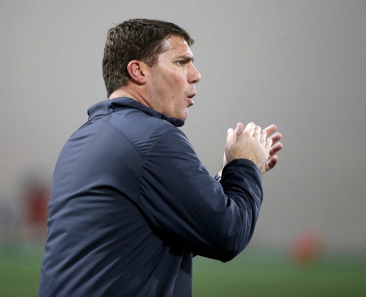 Ohio State defensive coordinator Chris Ash works with players.