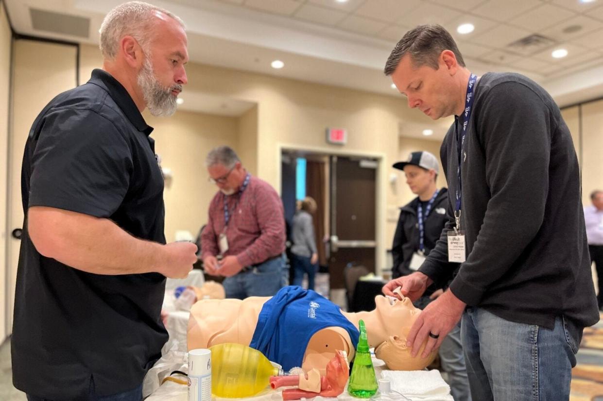 Dr. Tyler Price helps Michael Eaton – a nurse practitioner and an Avel eCare client from rural Texas – brush up on his intubation skills during a training seminar hosted by Avel eCare on April 28, 2023, in Sioux Falls.