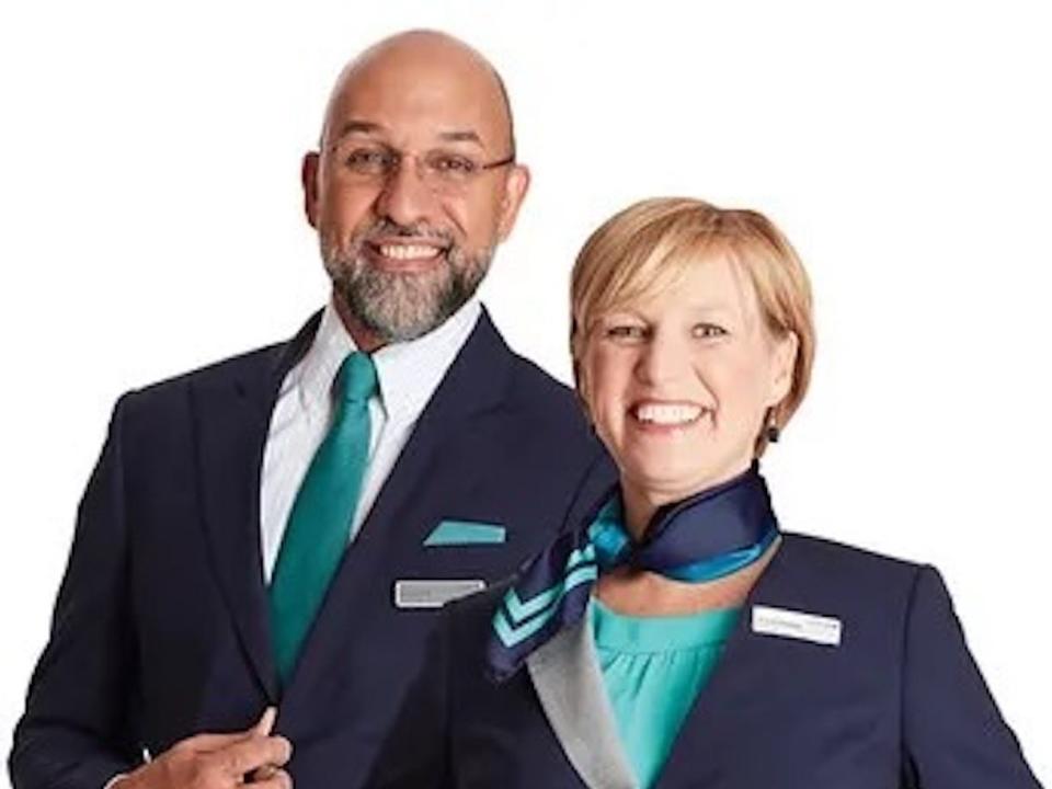 New United flight attendant uniform with teal on a male and female.