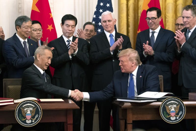 Then-President Donald Trump (R) shakes hands with Chinese Vice Premier Liu He after they signed a trade deal in the East Room at the White House on January 15, 2020. File Photo by Kevin Dietsch/UPI