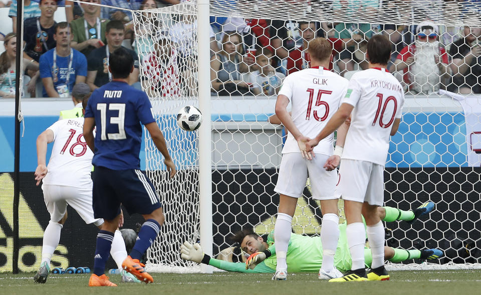 <p>Poland goalkeeper Lukasz Fabianski, in for Wojciech Szczęsny makes a save from Japan’s Yoshinori Muto </p>